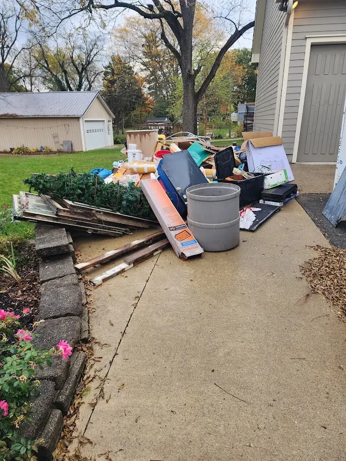 Dumpster being loaded with debris for Demolition Dumpster Rental in Shillington
